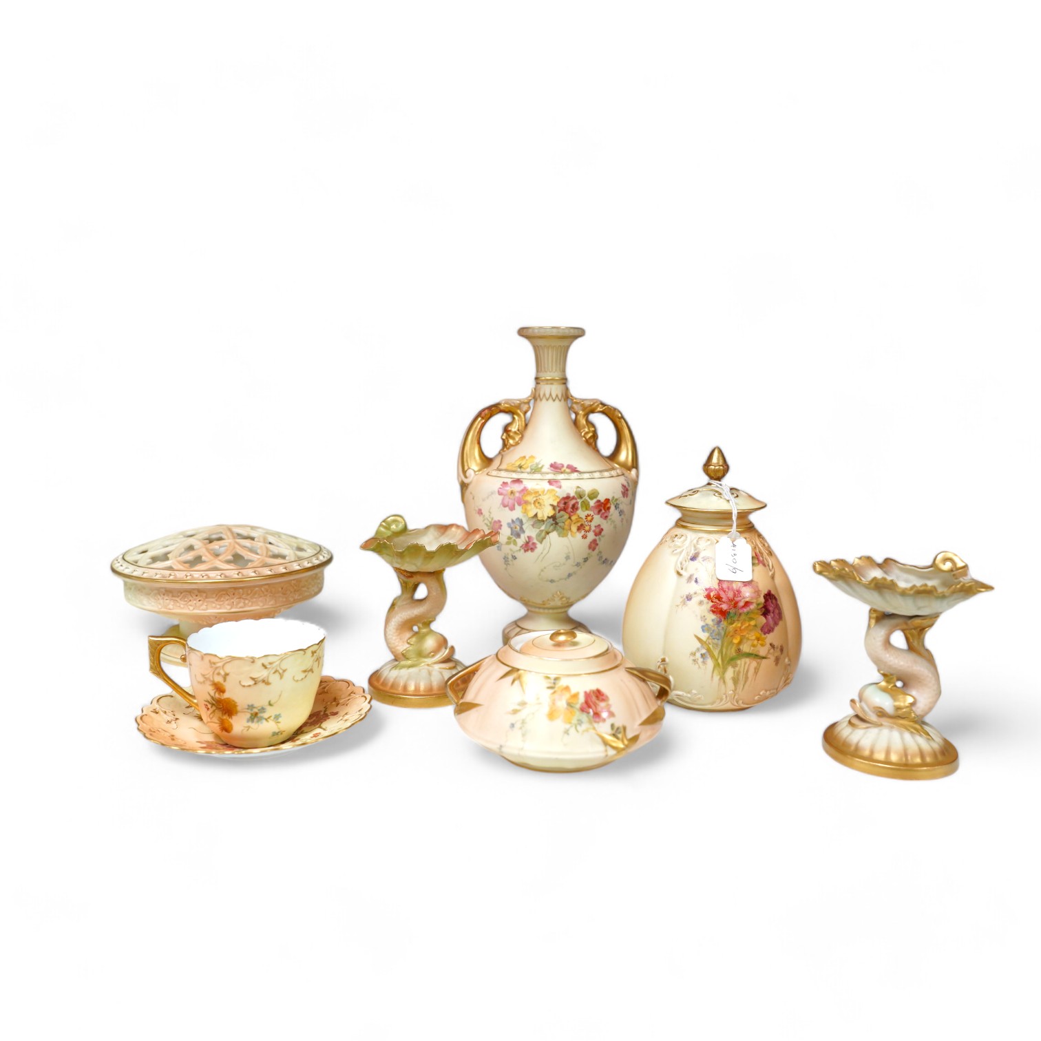 Royal Worcester blush ivory ornamental items: including a vase, two pots and covers, two dolphin stands, a cup and saucer and pierced bowl and cover (8). Condition - fair to good